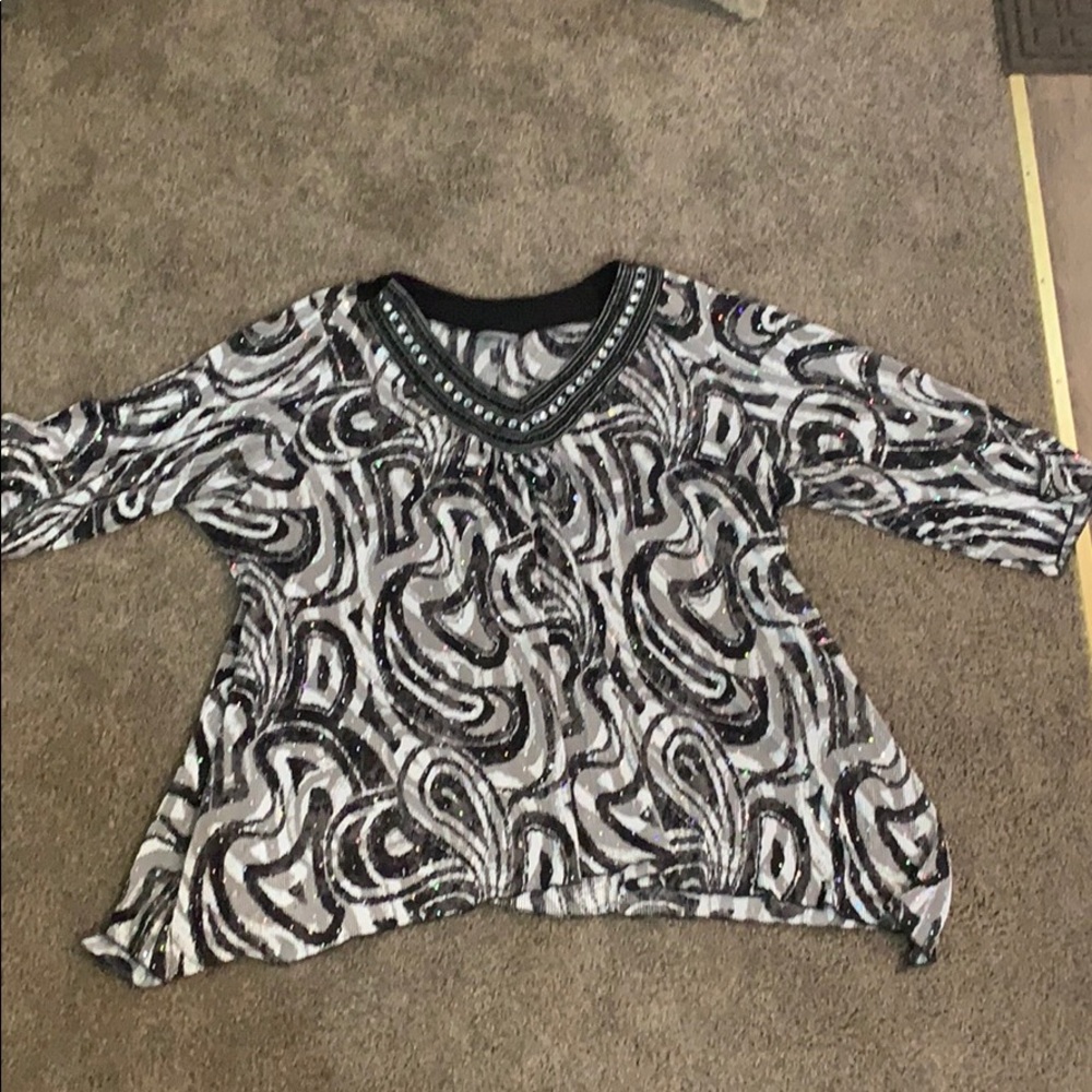 We have this black and white blouse with sparkles